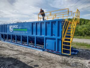 A mobile clarifier being set up on a mining site for wastewater treatment, designed to remove suspended solids and oils from process water.