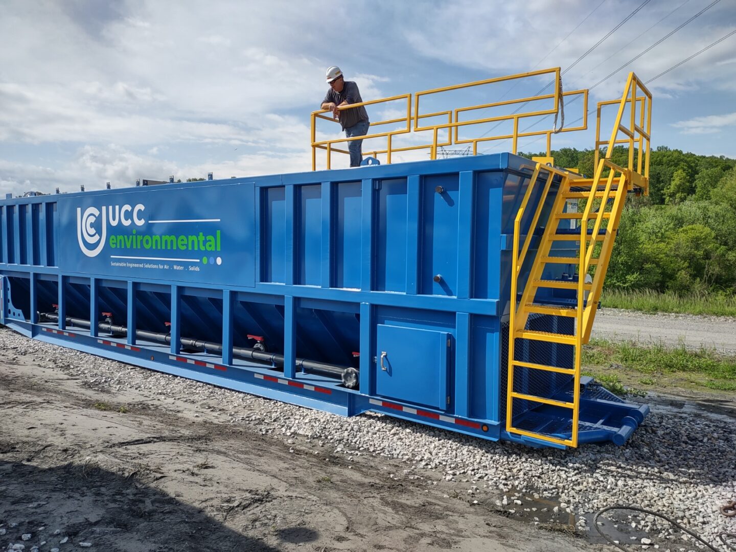 A mobile clarifier being set up on a mining site for wastewater treatment, designed to remove suspended solids and oils from process water.